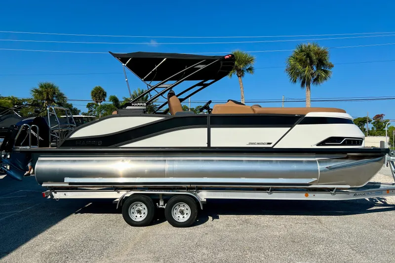 The Image of 2026 Harris Grand Mariner 230 pontoon boat on trailer. - 1