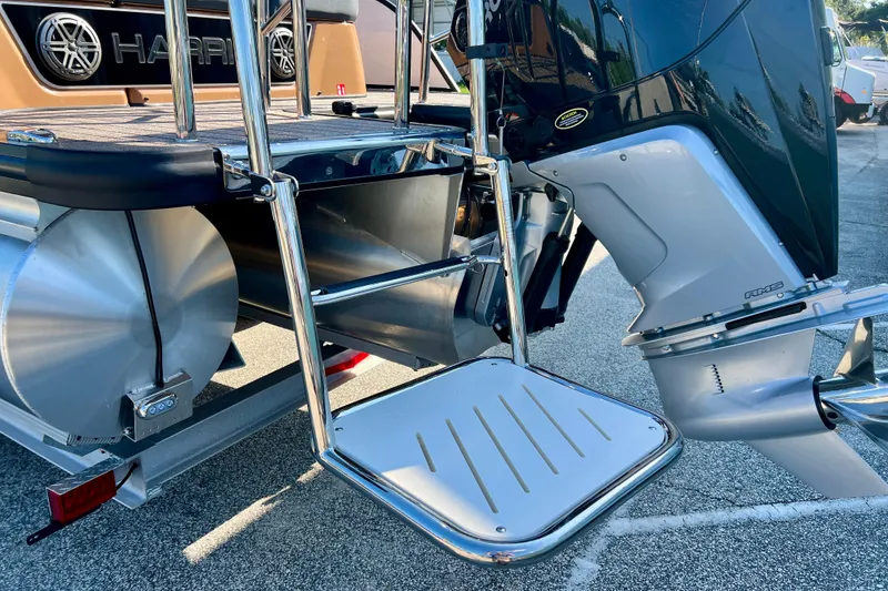 Slide: The Image of Harris Grand Mariner 230 2026 with outboard motor and swim platform. - 10