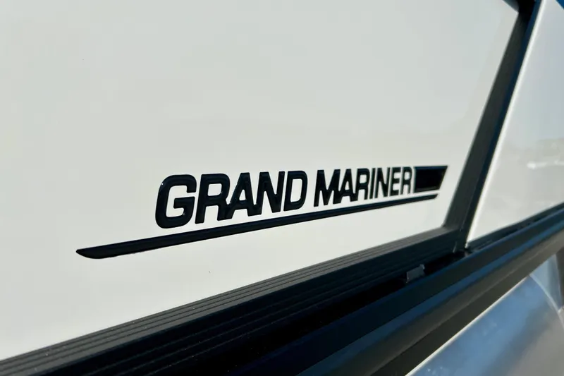 Slide: The Image of 2026 Harris Grand Mariner 230 emblem on white background. - 11