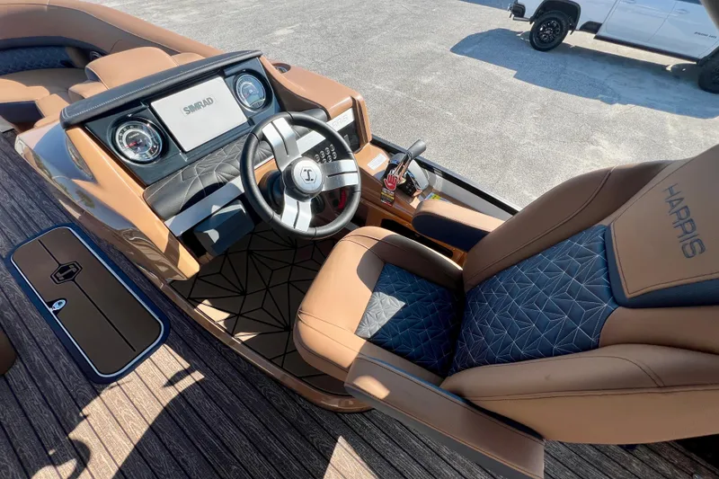 Slide: The Image of Interior of 2026 Harris Grand Mariner 230 with luxurious steering wheel and seats. - 15