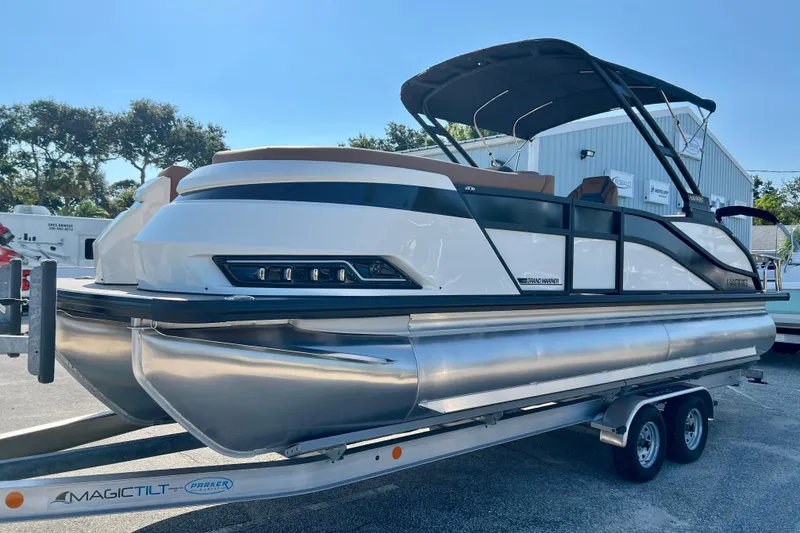 Slide: The Image of 2026 Harris Grand Mariner 230 pontoon boat on trailer. - 4
