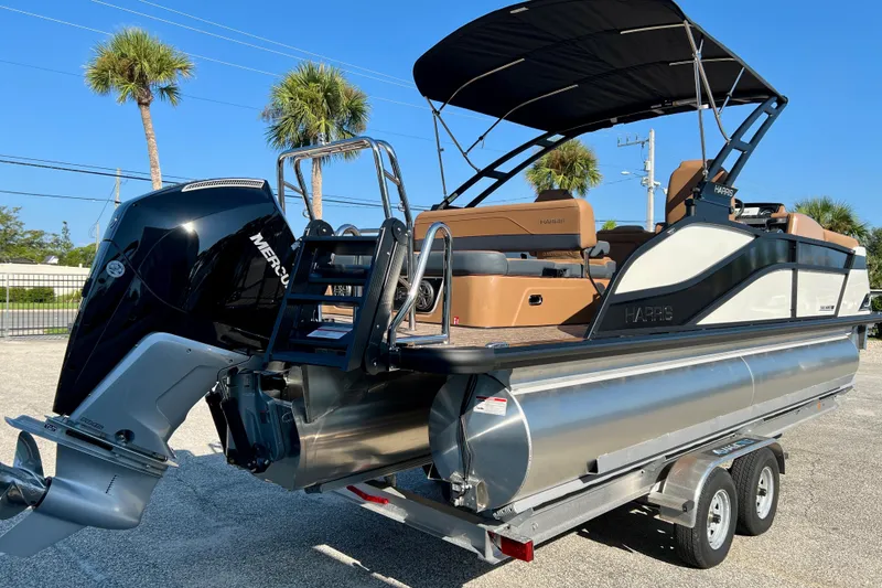 Slide: The Image of 2026 Harris Grand Mariner 230 pontoon boat with Mercury engine on trailer. - 8