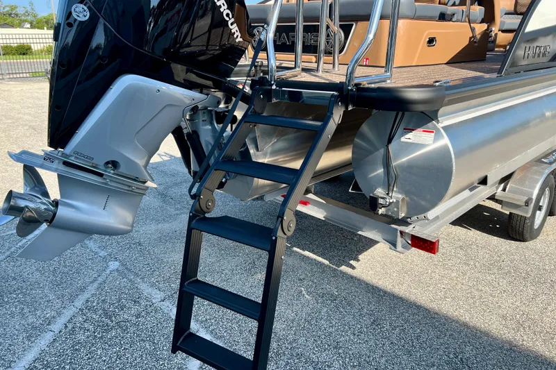 Slide: The Image of Harris Grand Mariner 230 2026 with outboard motor and ladder. - 9