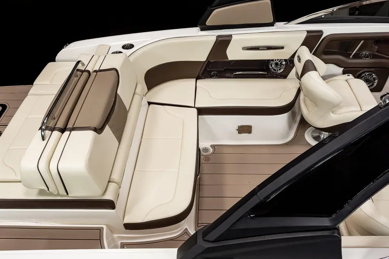 Slide: The Image of Manufacturer Provided Image: 2021 Chaparral 267 SSX boat interior with beige and brown seating. - 13