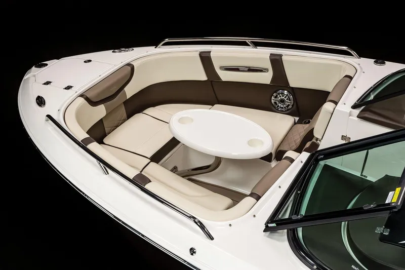 Slide: The Image of Manufacturer Provided Image: 2021 Chaparral 267 SSX boat interior with cushioned seating and round table. - 5