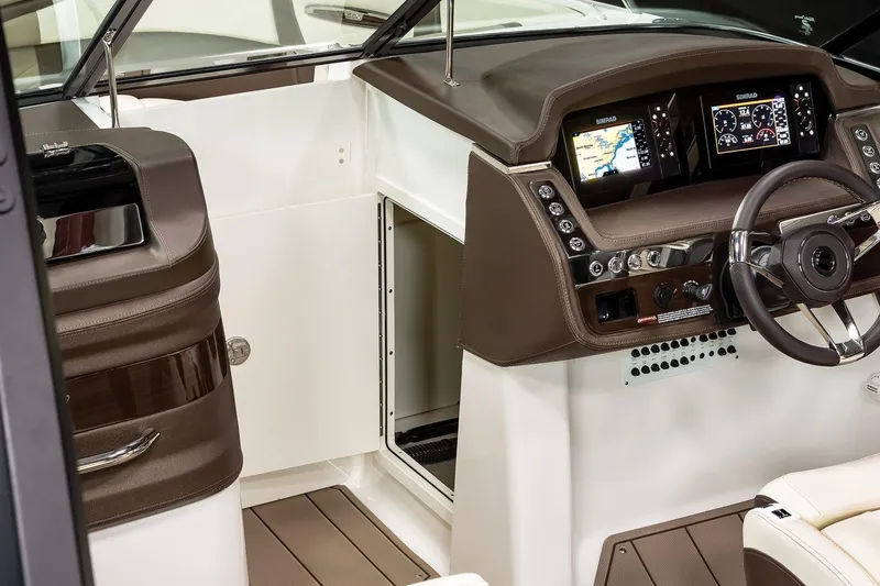 Slide: The Image of Manufacturer Provided Image: 2021 Chaparral 267 SSX boat cockpit with modern dashboard and navigation system. - 7