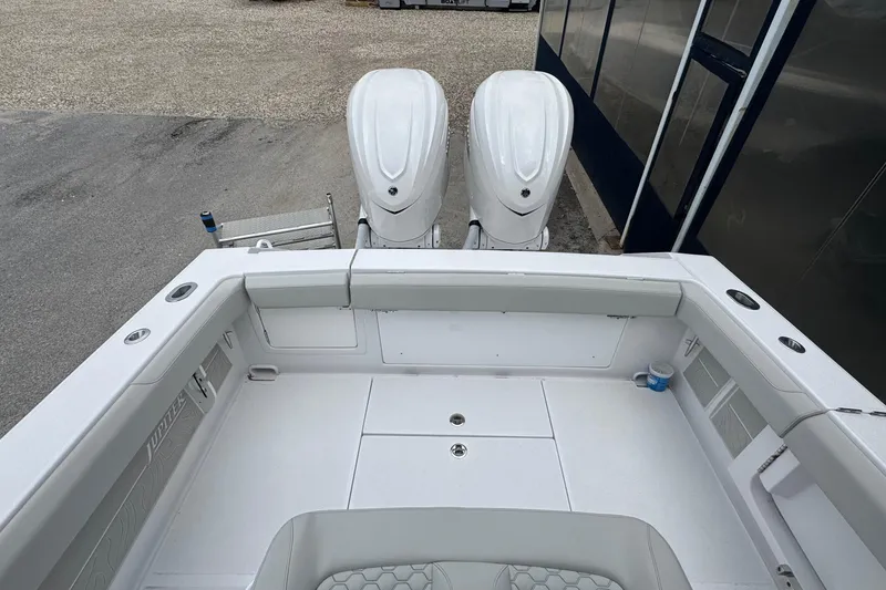 Slide: The Image of 2026 Jupiter 30 boat with dual engines, spacious deck, and modern design. - 15