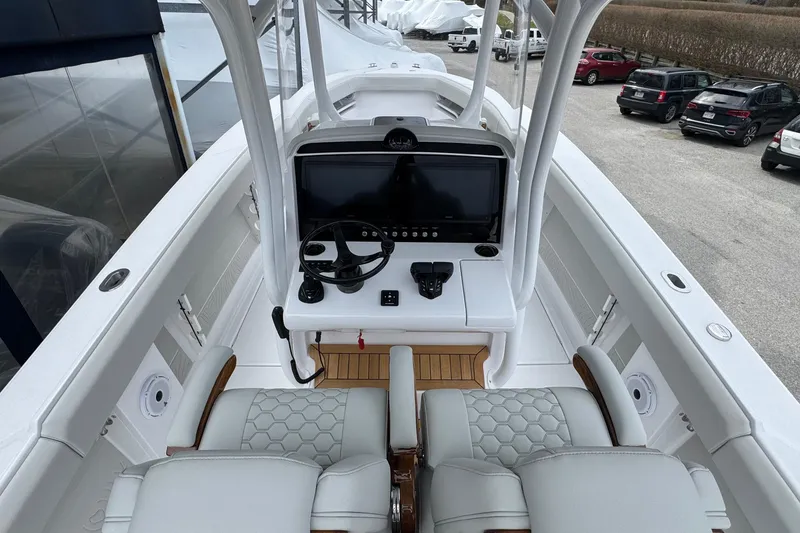 Slide: The Image of Interior view of 2026 Jupiter 30 boat cockpit with modern steering and controls. - 34