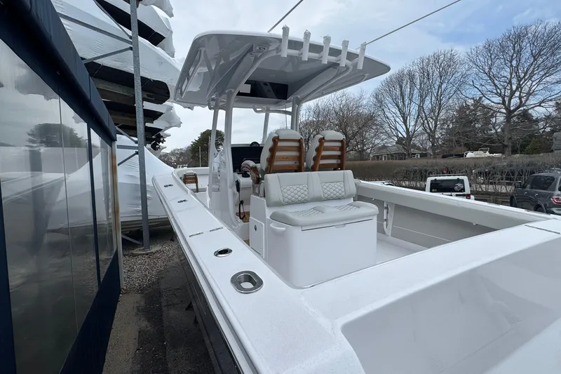 Slide: The Image of 2026 Jupiter 30 boat with sleek white interior and modern seating design. - 4