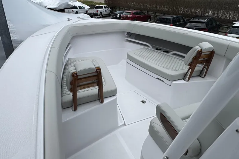 Slide: The Image of Luxurious seating area on a 2026 Jupiter 30 boat, featuring elegant white upholstery. - 48