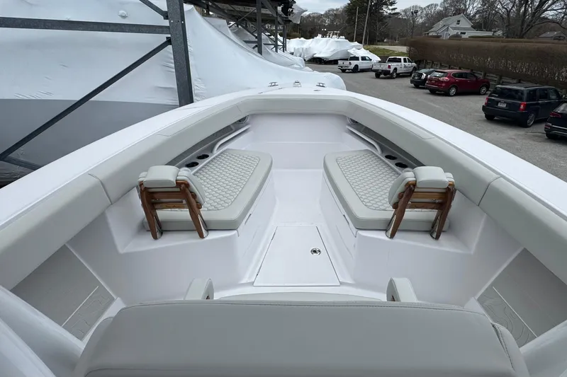 Slide: The Image of Luxurious 2026 Jupiter 30 boat interior with cushioned seating and sleek design. - 49