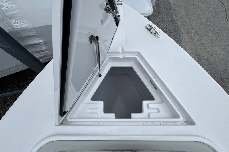Slide: The Image of Open storage compartment on a 2026 Jupiter 30 boat deck. - 56