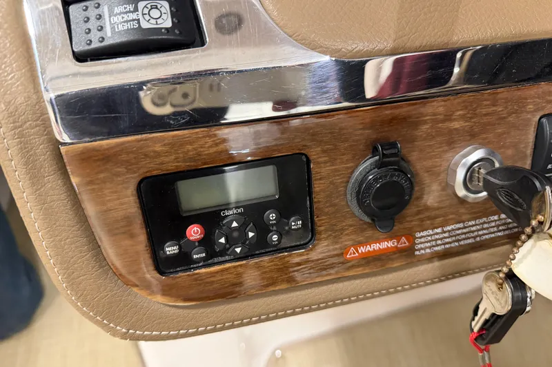 Slide: The Image of Control panel of a 2014 Chaparral 257 SSX boat with Clarion audio system. - 13