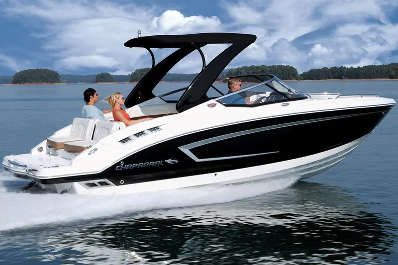 Slide: The Image of 2014 Chaparral 257 SSX boat on trailer in a workshop setting. - 2