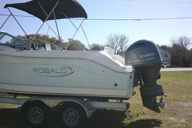 Slide: The Image of 2019 Robalo R207 Dual Console boat on trailer with Yamaha outboard motor. - 10