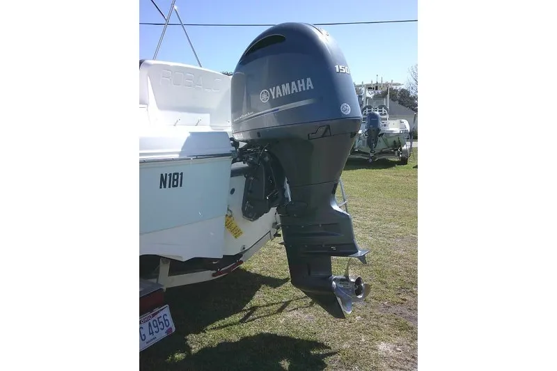 Slide: The Image of 2019 Robalo R207 Dual Console with Yamaha 150 outboard engine on display. - 11