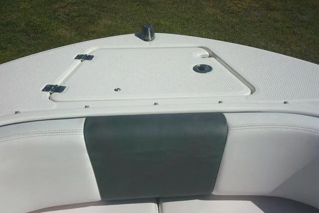 Slide: The Image of 2019 Robalo R207 Dual Console boat bow with storage compartment and cushioned seating. - 19