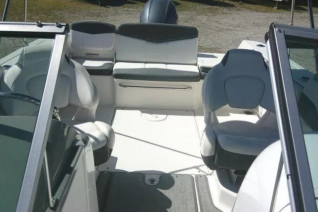 Slide: The Image of 2019 Robalo R207 Dual Console boat interior with seating and console view. - 20