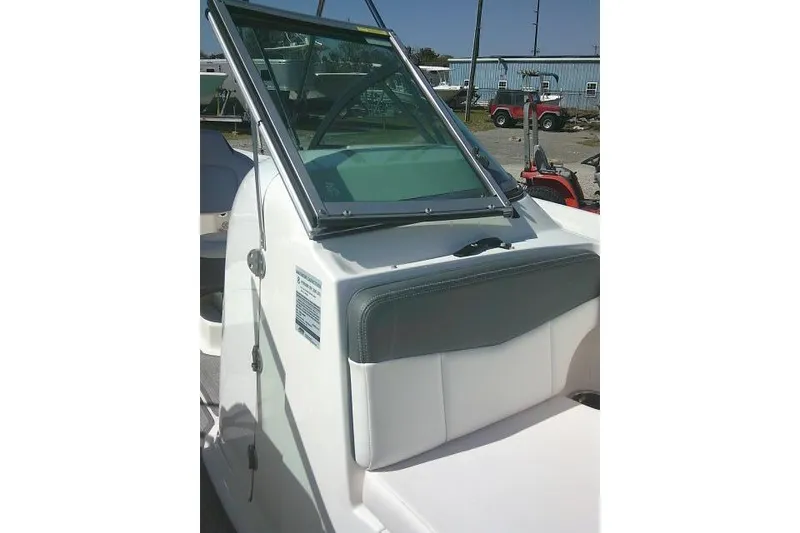 Slide: The Image of 2019 Robalo R207 Dual Console boat with windshield and seating detail. - 22