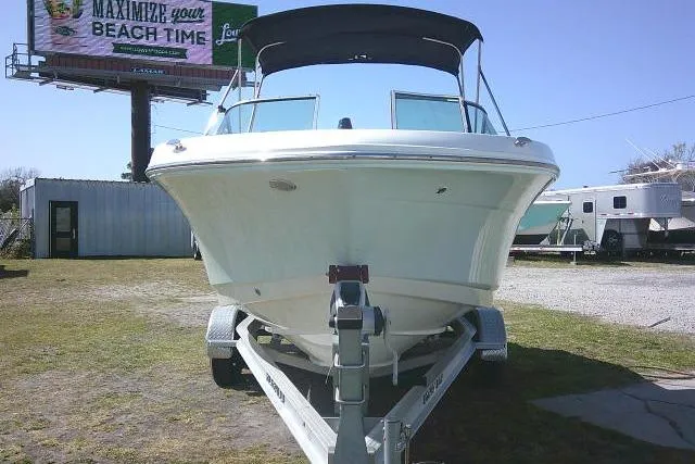 Slide: The Image of 2019 Robalo R207 Dual Console boat on trailer, outdoor display. - 3