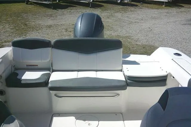 Slide: The Image of 2019 Robalo R207 Dual Console boat interior with seating and motor. - 33