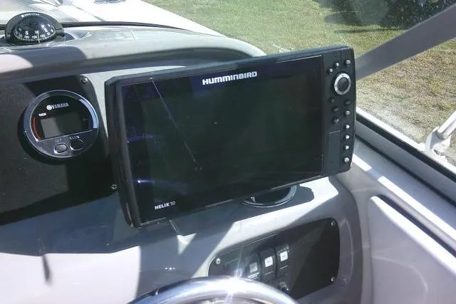 Slide: The Image of Dashboard of 2019 Robalo R207 Dual Console with Humminbird Helix 10 fishfinder. - 34