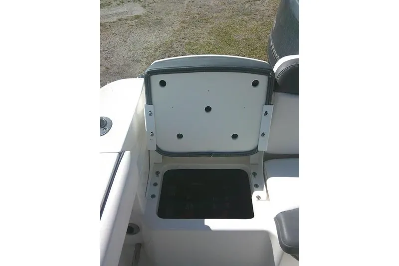 Slide: The Image of Open storage compartment on a 2019 Robalo R207 Dual Console boat. - 37