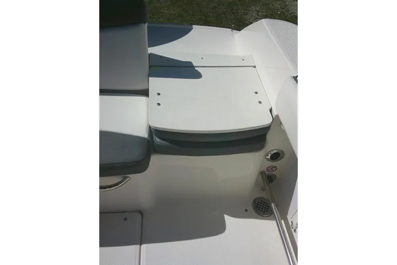 Slide: The Image of 2019 Robalo R207 Dual Console boat seating area with white upholstery. - 40