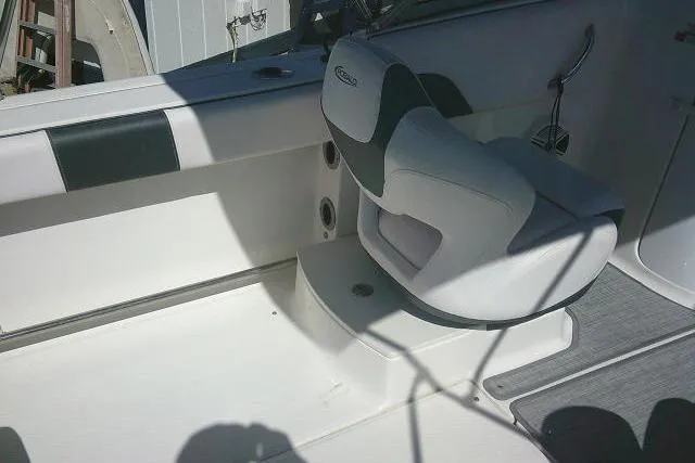 Slide: The Image of 2019 Robalo R207 Dual Console boat interior with cushioned seating and sleek design. - 43