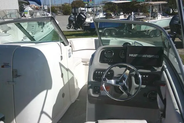 Slide: The Image of 2019 Robalo R207 Dual Console boat interior with steering wheel and dashboard. - 44