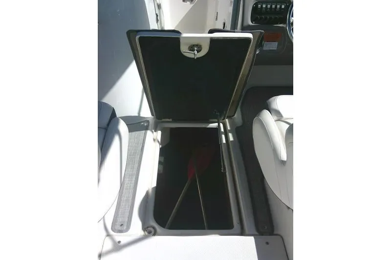 Slide: The Image of Open storage compartment on 2019 Robalo R207 Dual Console boat interior. - 45