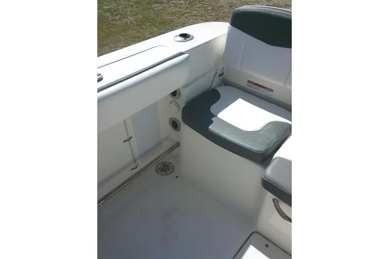 Slide: The Image of 2019 Robalo R207 Dual Console boat interior with seating and cup holder. - 47