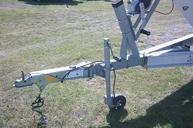 Slide: The Image of Trailer hitch of 2019 Robalo R207 Dual Console on grassy field. - 5