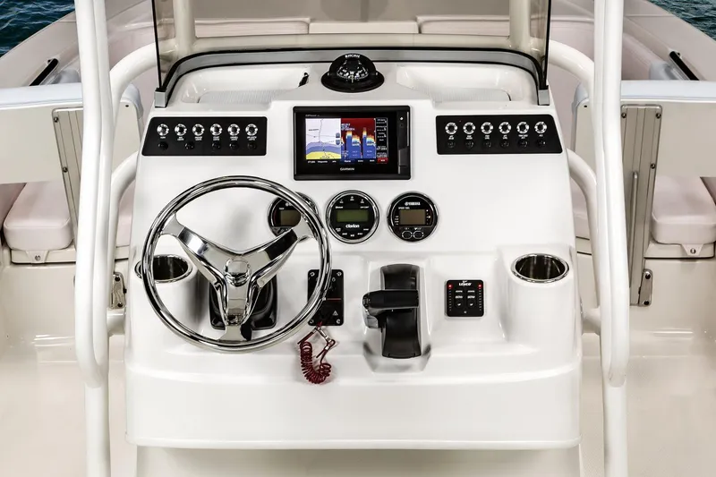Slide: The Image of Manufacturer Provided Image: 2020 Robalo 206 Cayman boat dashboard with steering wheel and electronic controls. - 10