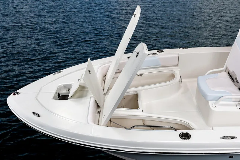 Slide: The Image of Manufacturer Provided Image: 2020 Robalo 206 Cayman boat with open storage compartments on calm water. - 9