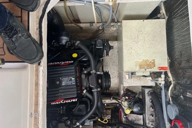 Slide: The Image of Engine compartment of a 1993 Maxum 2700 SCR boat with MerCruiser components. - 14