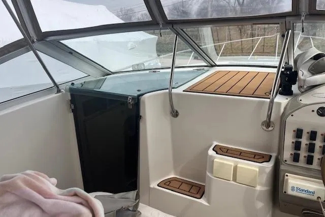 Slide: The Image of Interior view of a 1993 Maxum 2700 SCR boat cockpit with control panel. - 4