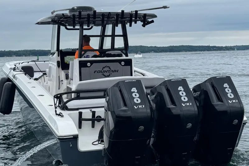 Slide: The Image of 2023 Fountain 38 CC Tournament Edition boat with four Mercury 400 V10 engines on water. - 1