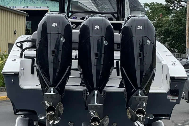 Slide: The Image of Triple outboard motors on a 2023 Fountain 38 CC Tournament Edition boat. - 10