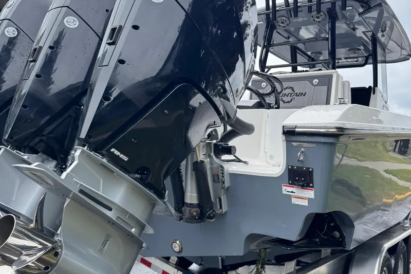 Slide: The Image of 2023 Fountain 38 CC Tournament Edition boat with powerful outboard engines. - 11