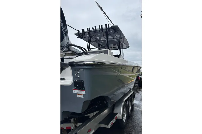 Slide: The Image of 2023 Fountain 38 CC Tournament Edition boat on trailer, side view. - 13