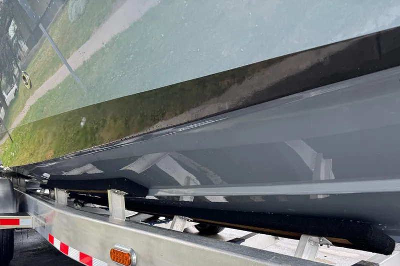 Slide: The Image of 2023 Fountain 38 CC Tournament Edition boat on trailer, side view. - 15