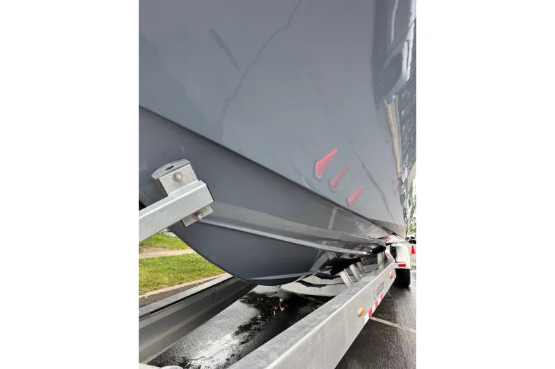 Slide: The Image of 2023 Fountain 38 CC Tournament Edition boat hull on trailer. - 17
