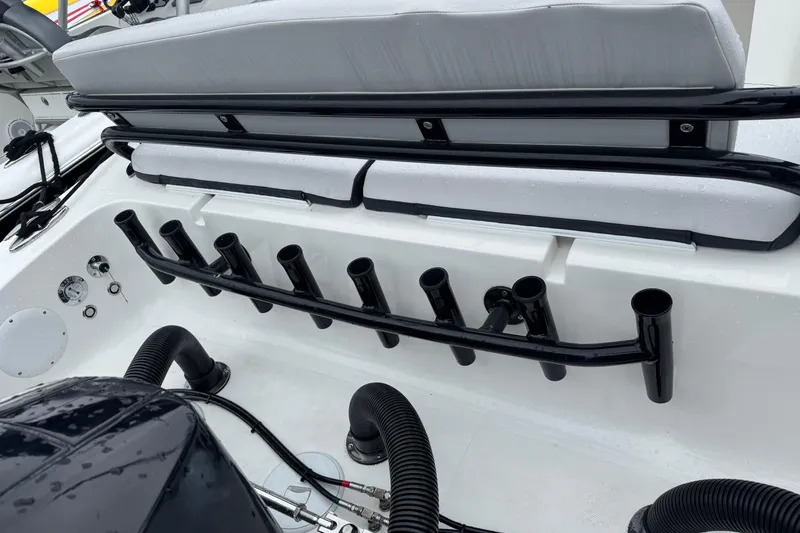 Slide: The Image of 2023 Fountain 38 CC Tournament Edition boat interior with rod holders and seating. - 18