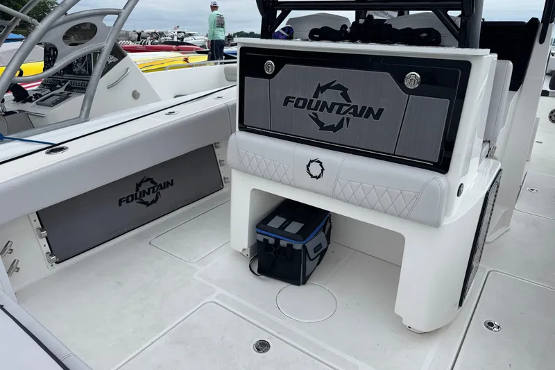 Slide: The Image of 2023 Fountain 38 CC Tournament Edition boat interior with branded seating and storage. - 20