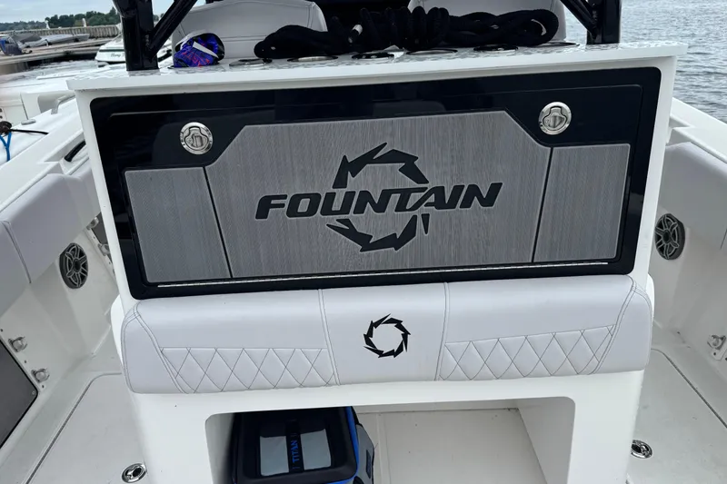 Slide: The Image of 2023 Fountain 38 CC Tournament Edition boat interior with logo and seating. - 21
