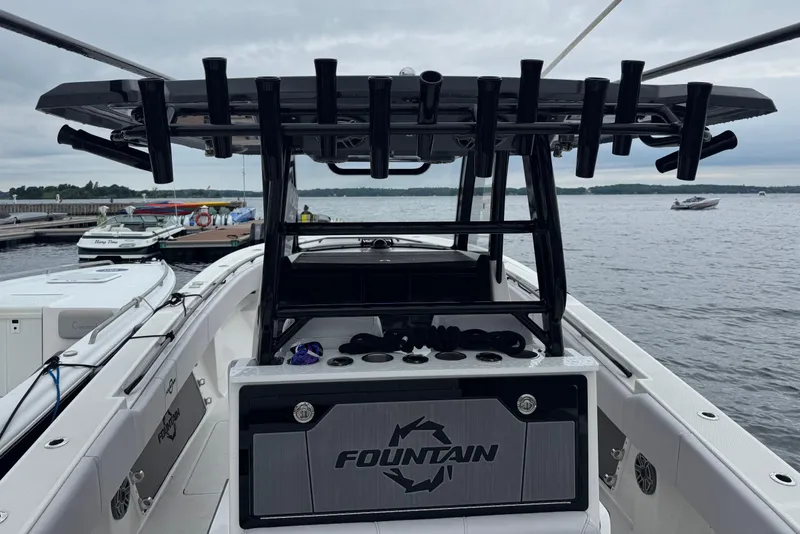 Slide: The Image of 2023 Fountain 38 CC Tournament Edition boat docked by the water. - 23