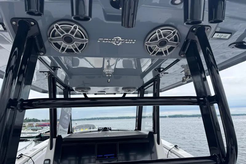 Slide: The Image of 2023 Fountain 38 CC Tournament Edition boat interior with speakers and sleek design. - 25