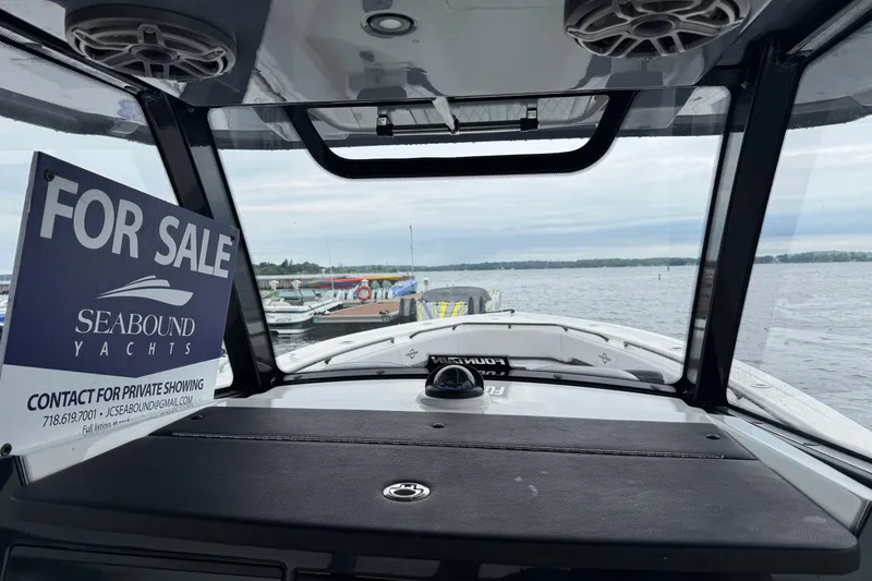 Slide: The Image of 2023 Fountain 38 CC Tournament Edition boat for sale at marina, Seabound Yachts contact info displayed. - 27