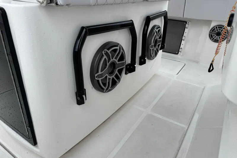 Slide: The Image of 2023 Fountain 38 CC Tournament Edition boat interior with speakers and safety handles. - 29